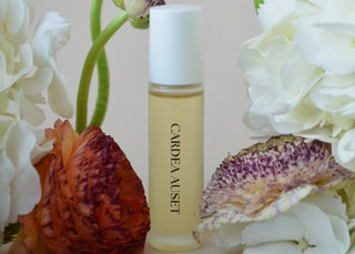 Skincare bottle with flowers in the background